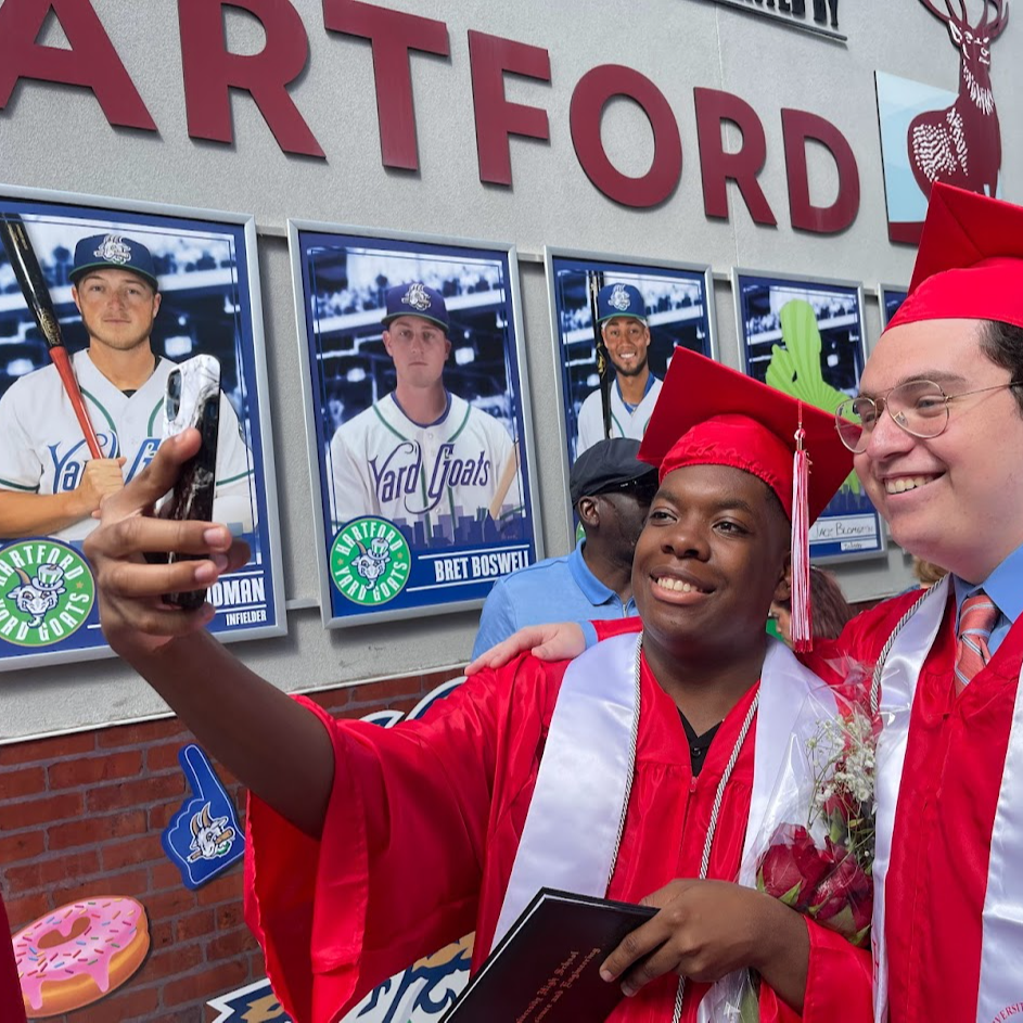 hogh school students graduating in caps and gowns