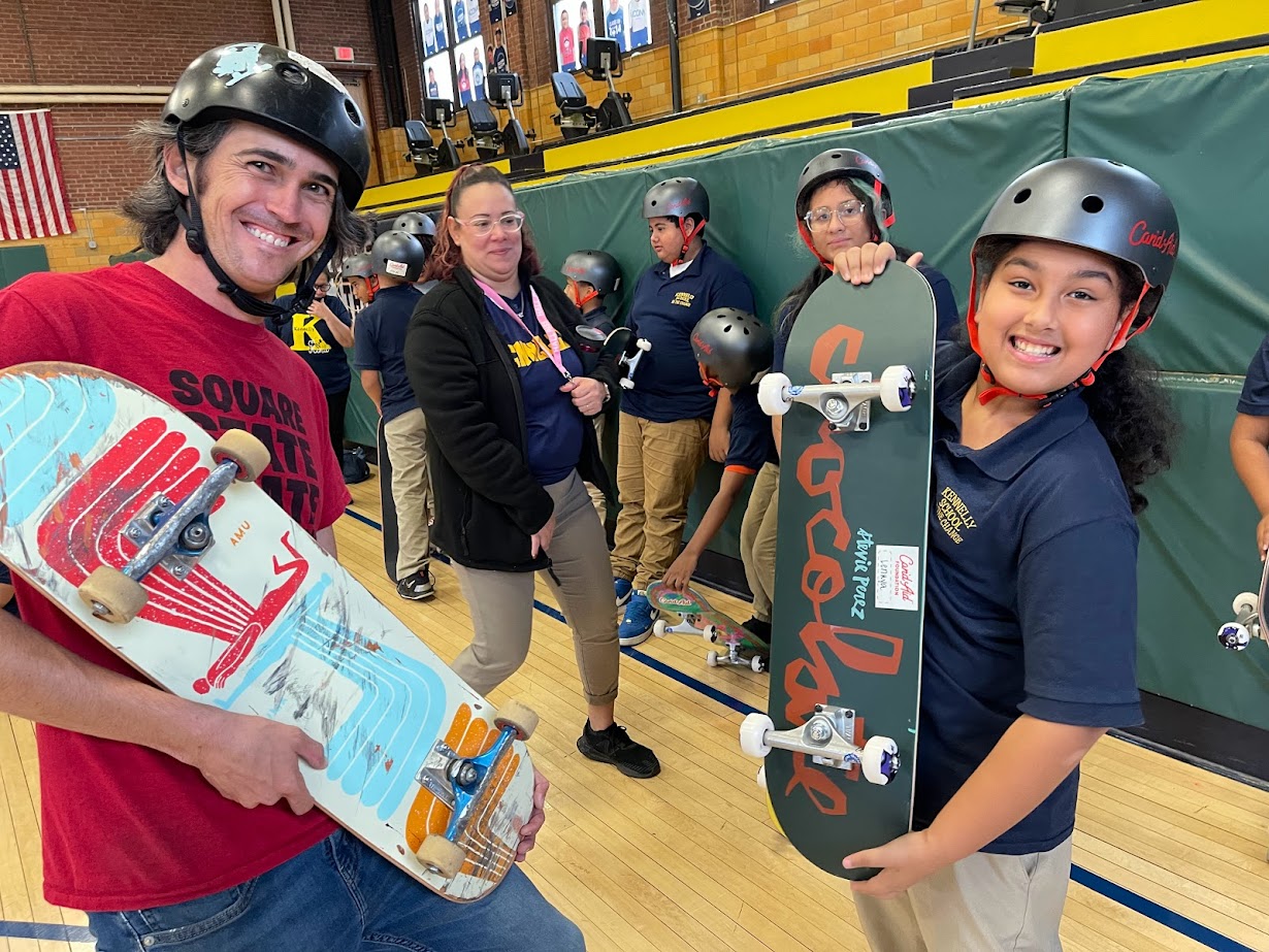 Candaid donates skateboards and helmets to Kennelly students