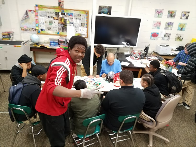 students in class around a table