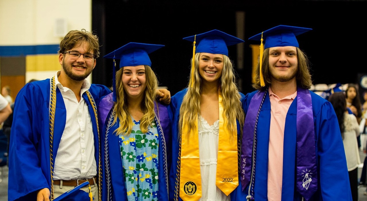 students in graduation cap and gowns