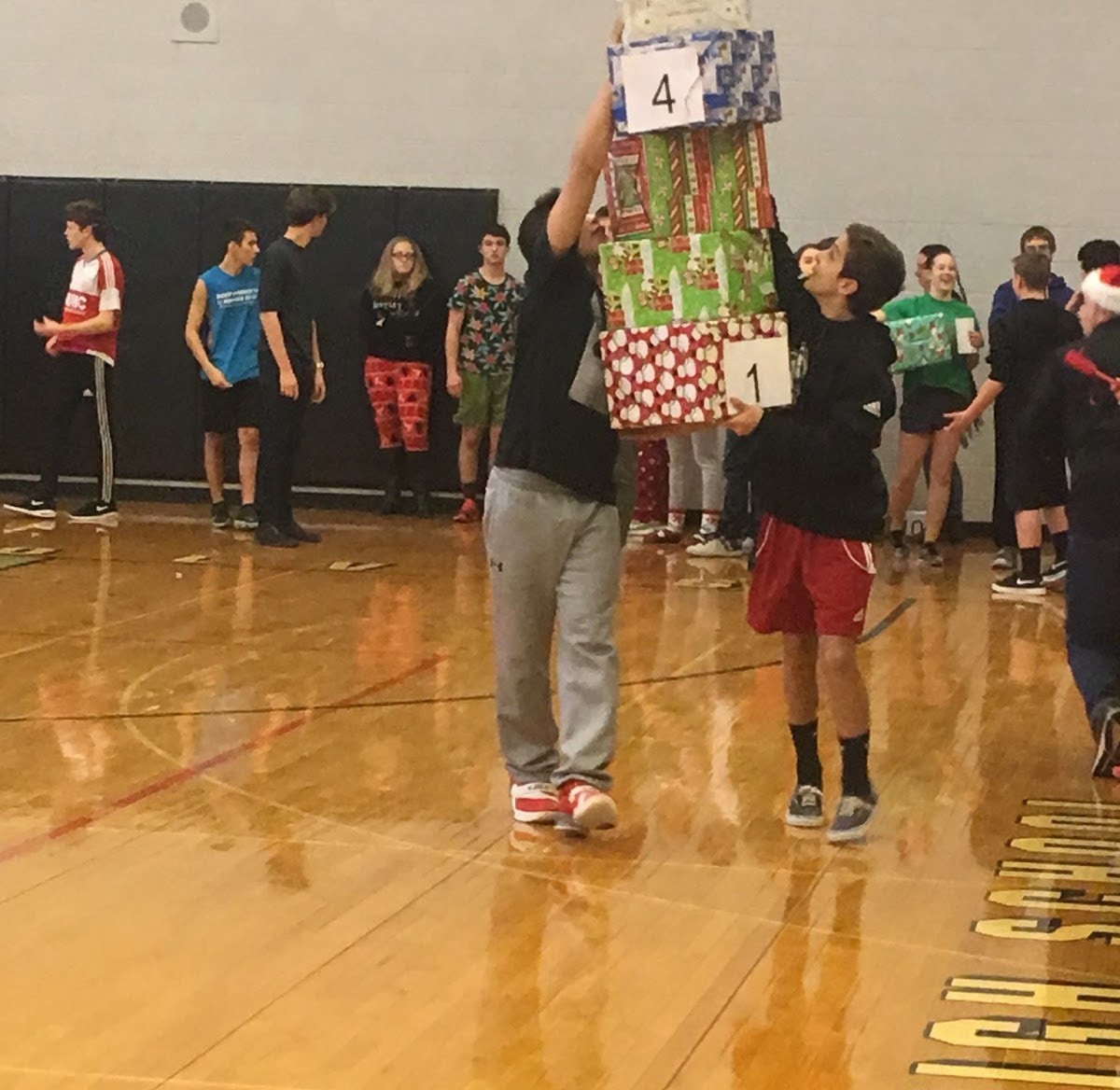 students carrying gifts