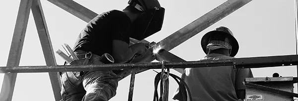 A black and white picture of a construction worker