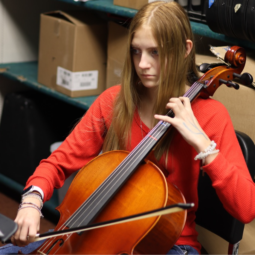 middle school student playing cello