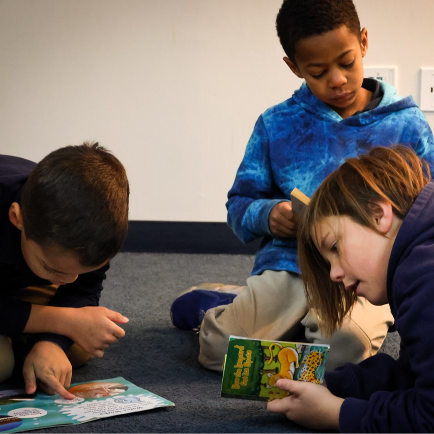 elementary students reading together