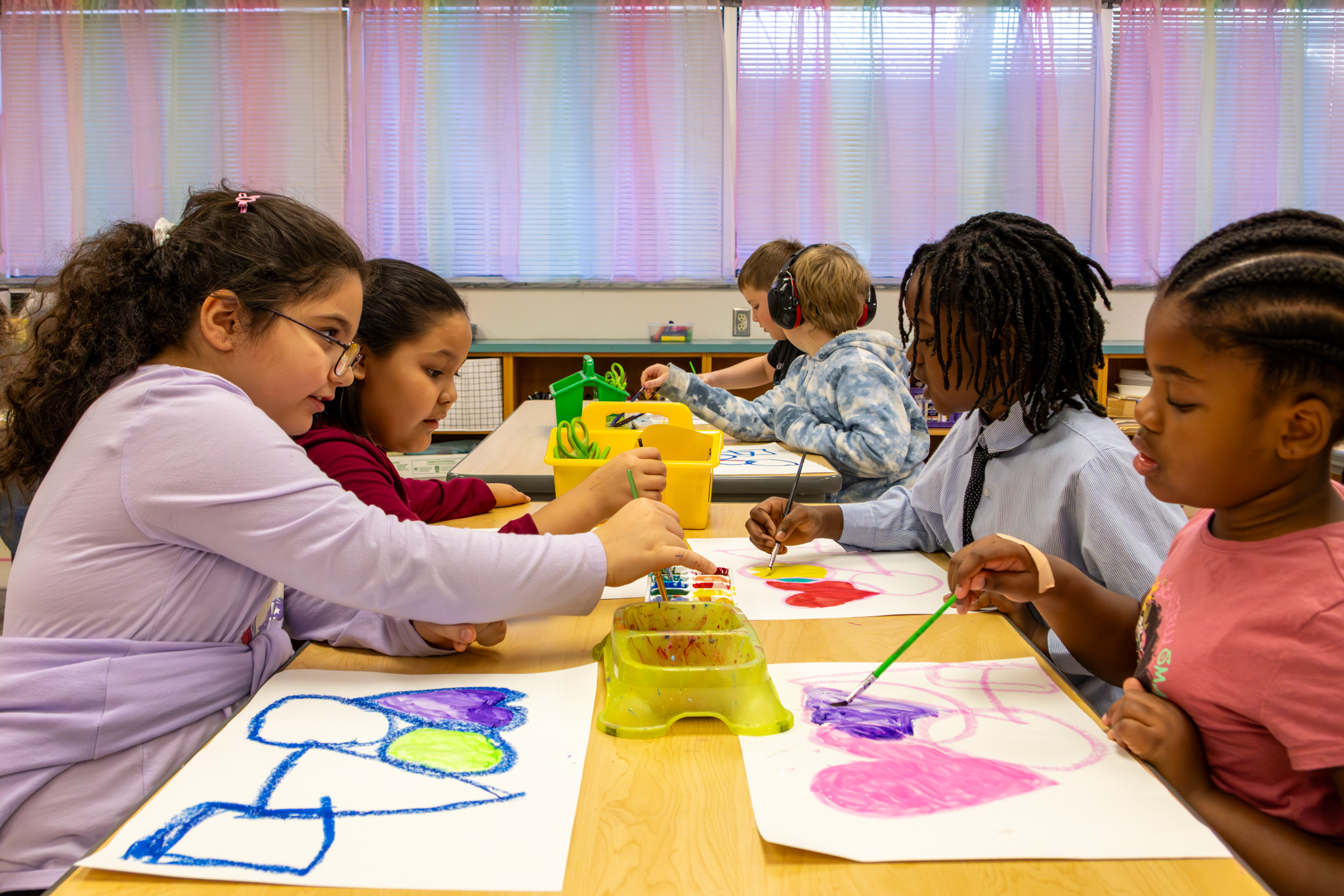 Students painting shapes