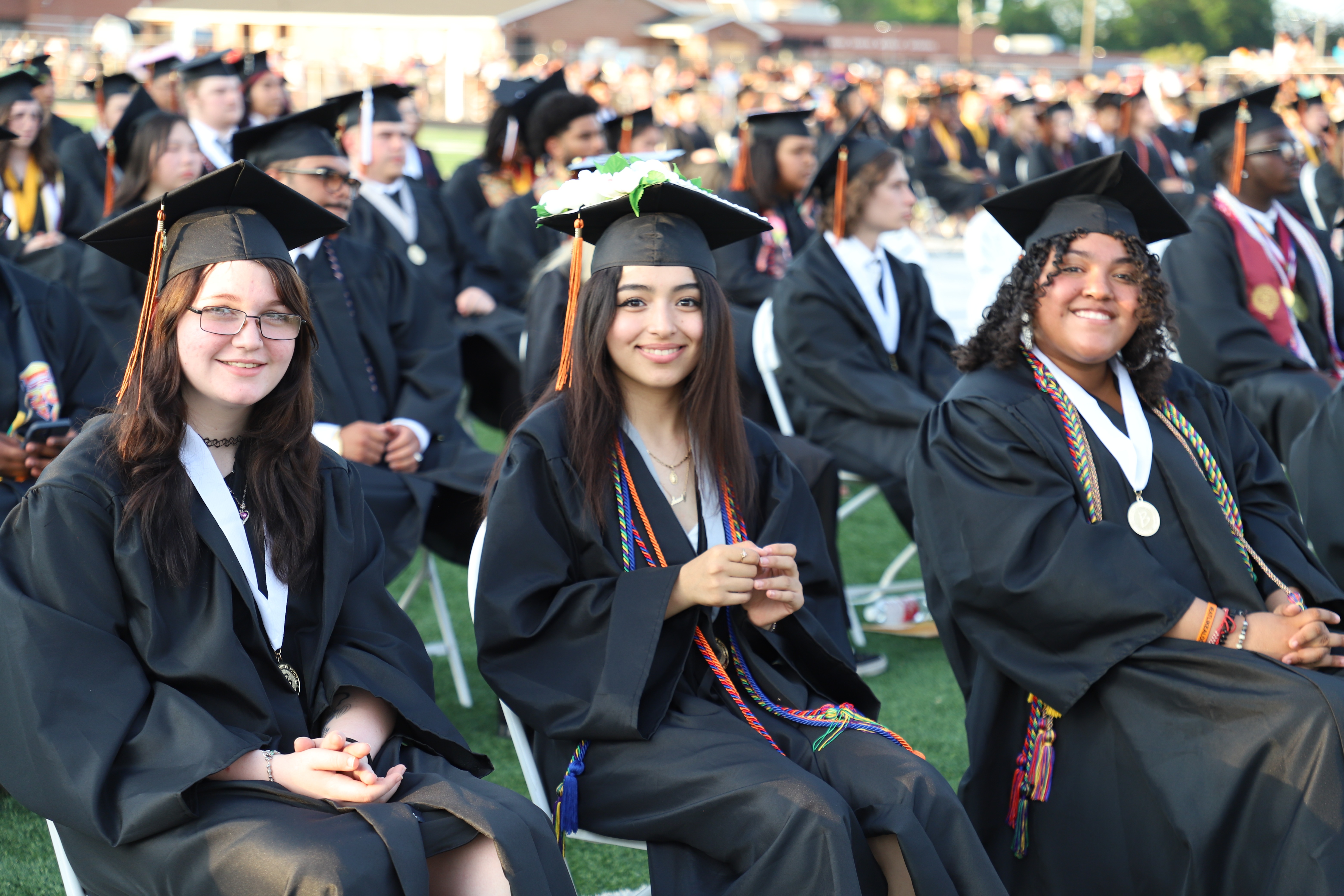 graduates sitting together