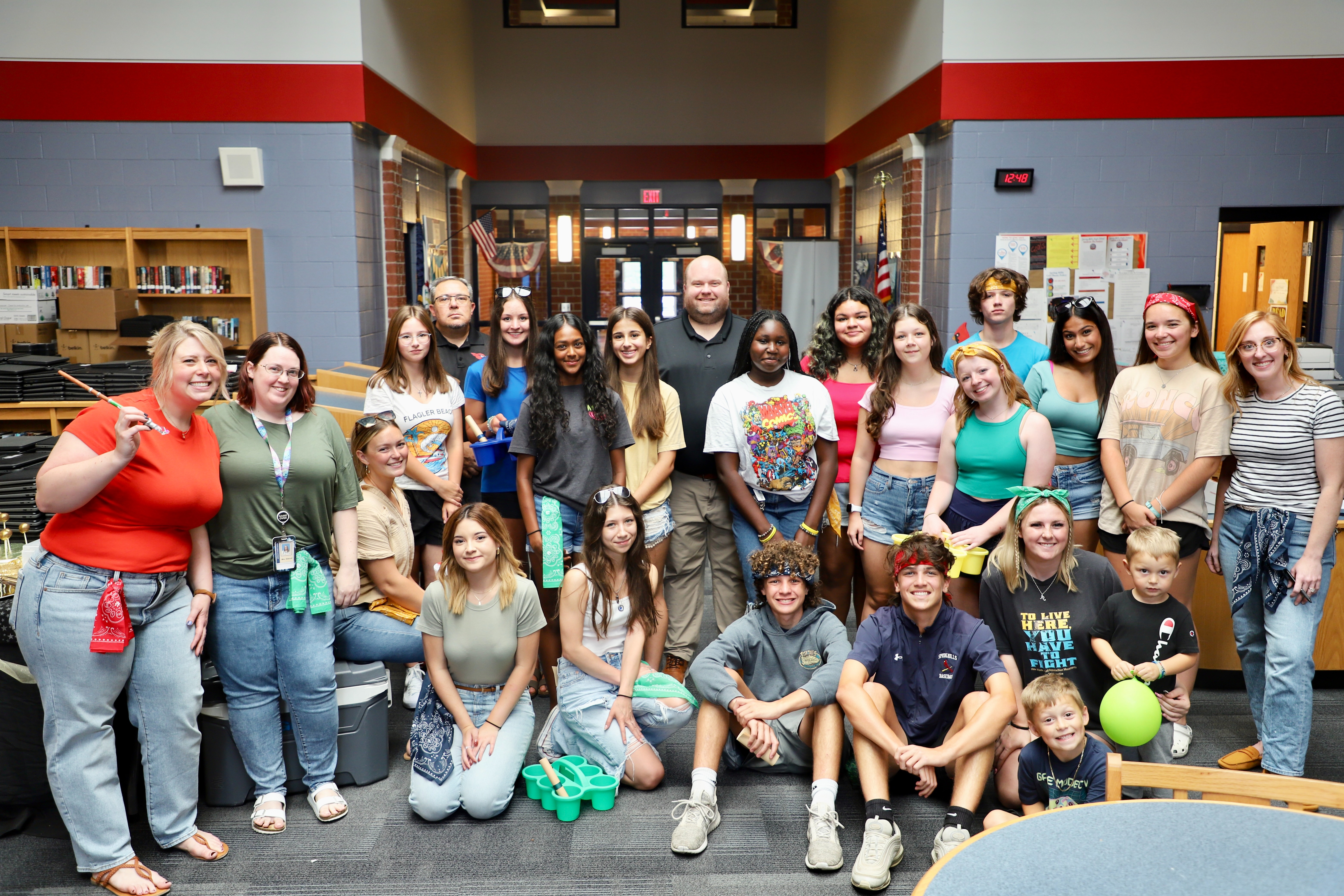 students in a group smiling 