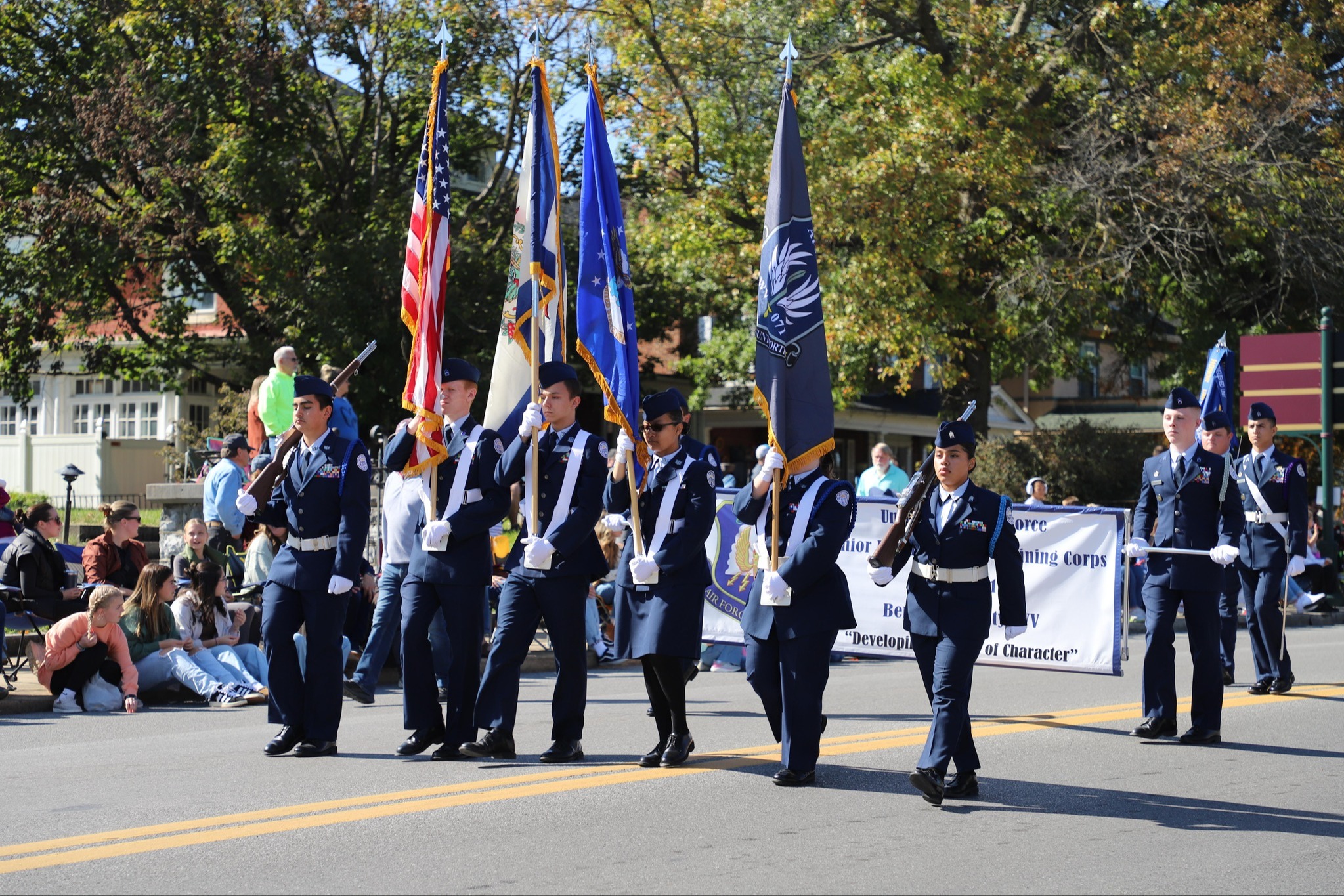 students marching with flags