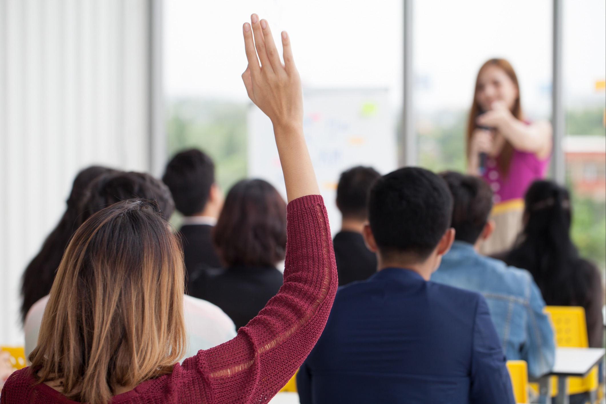 student raising hand