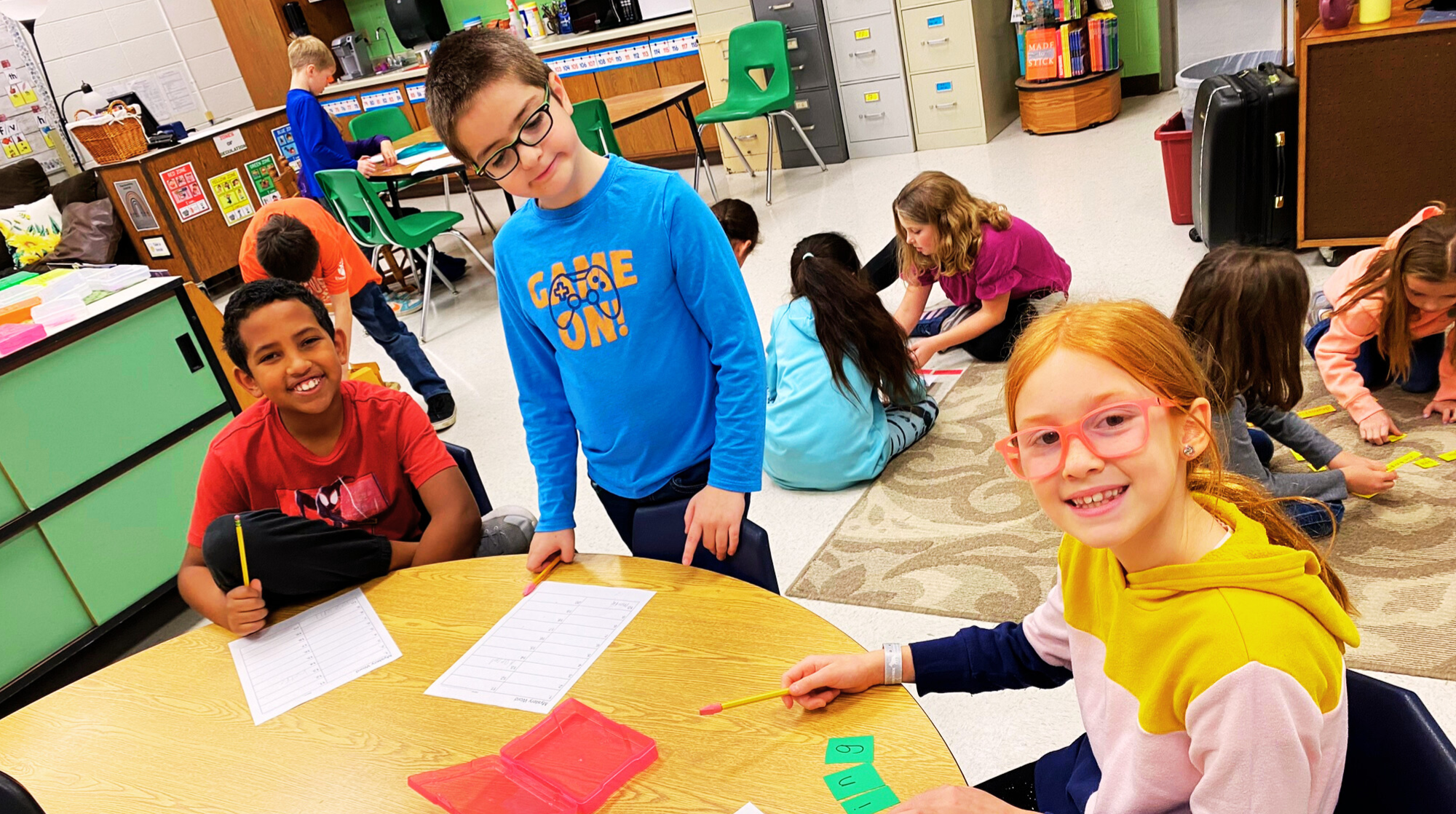 Elementary students solve word puzzles