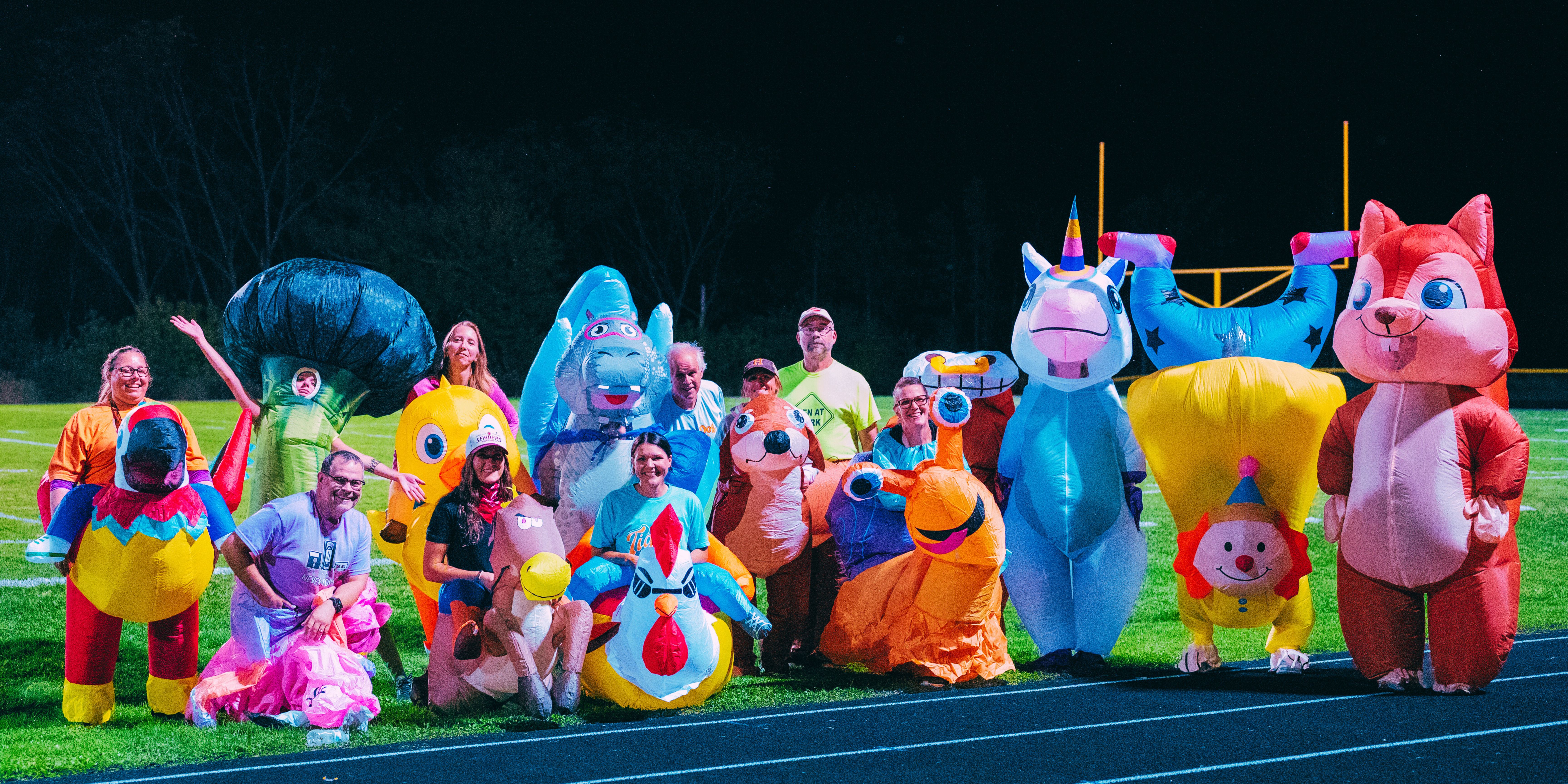 Homecoming, teachers dressed up in inflatables.