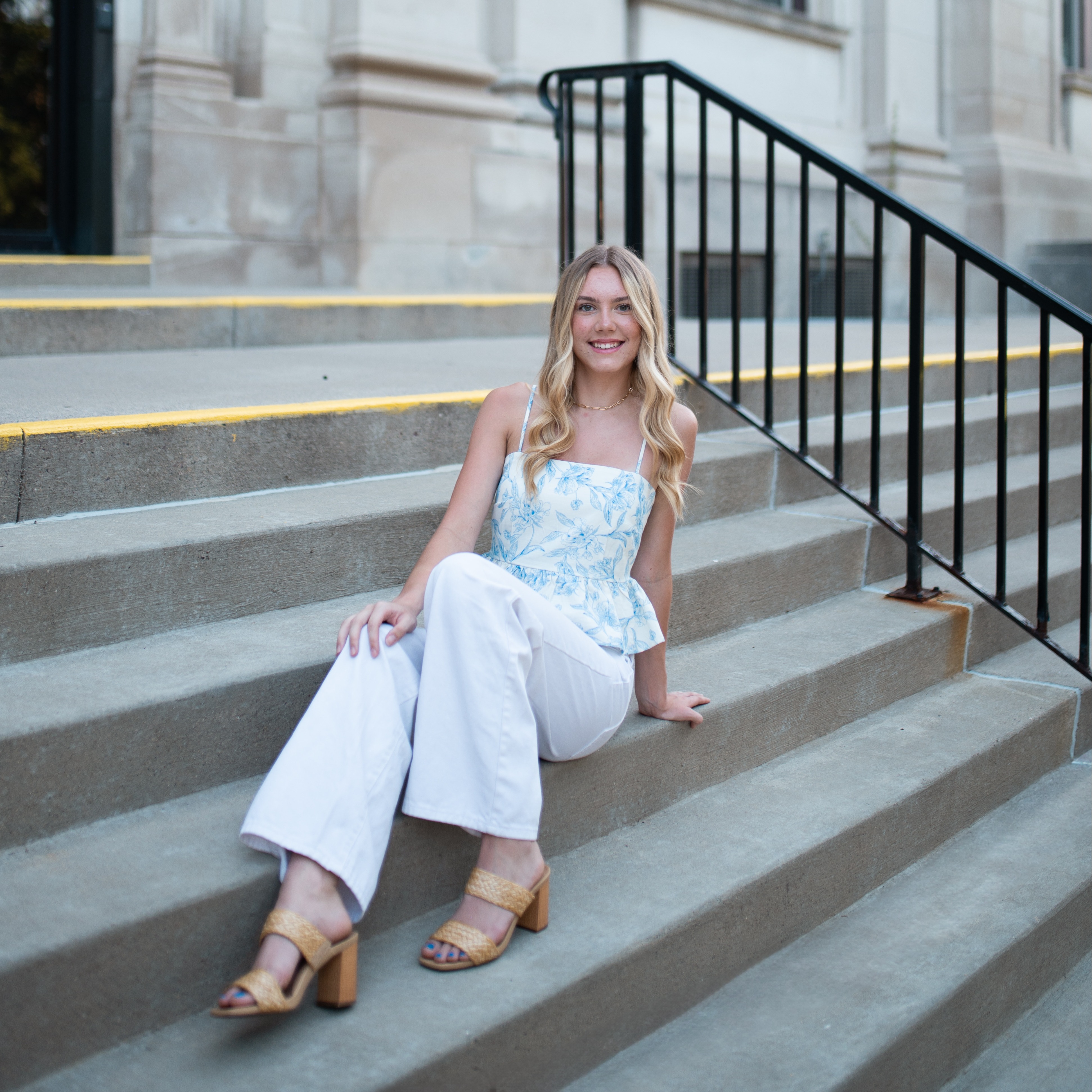 Kianna Griffiths poses on steps