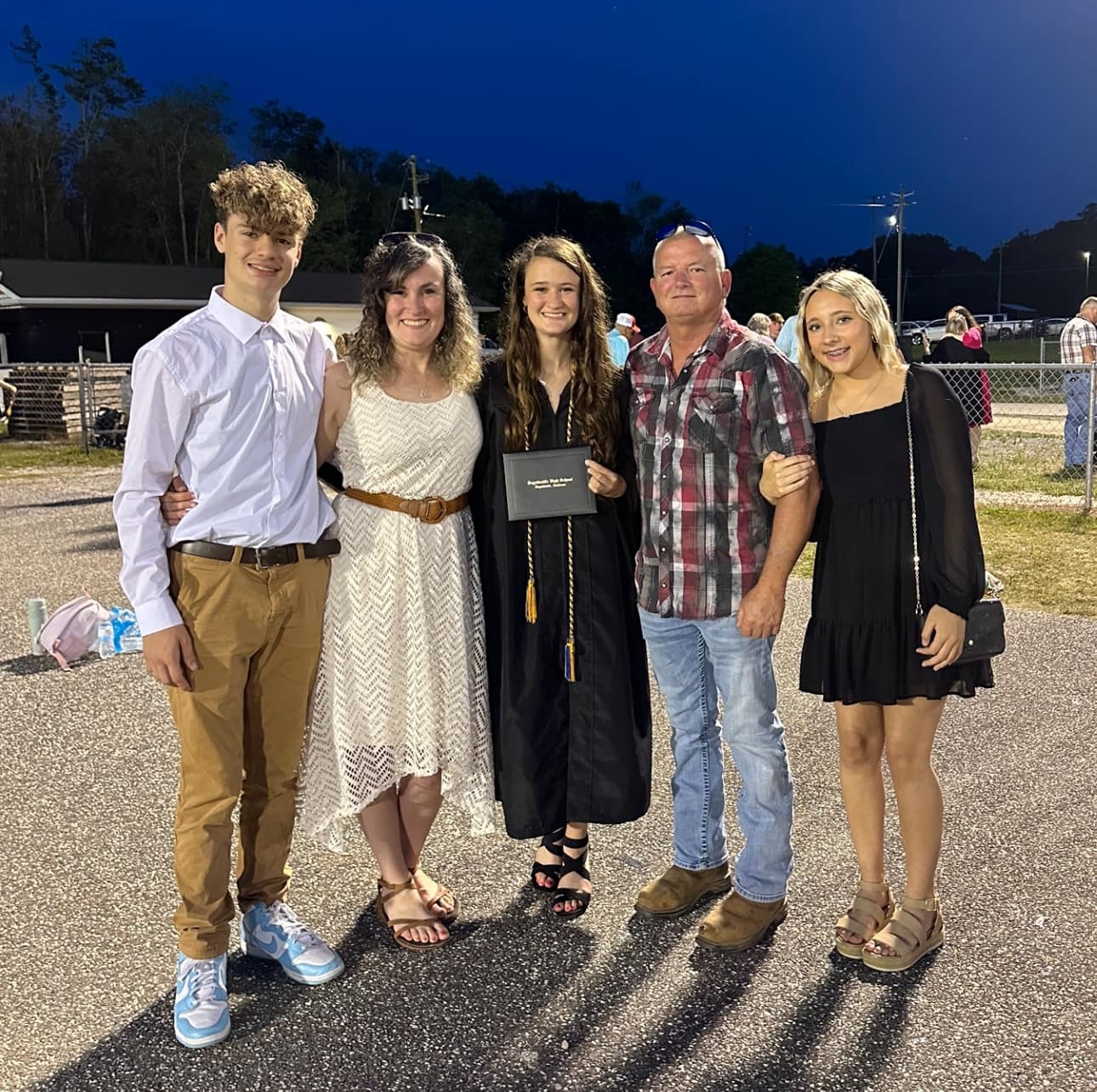 Amber and family at graduation ceremony