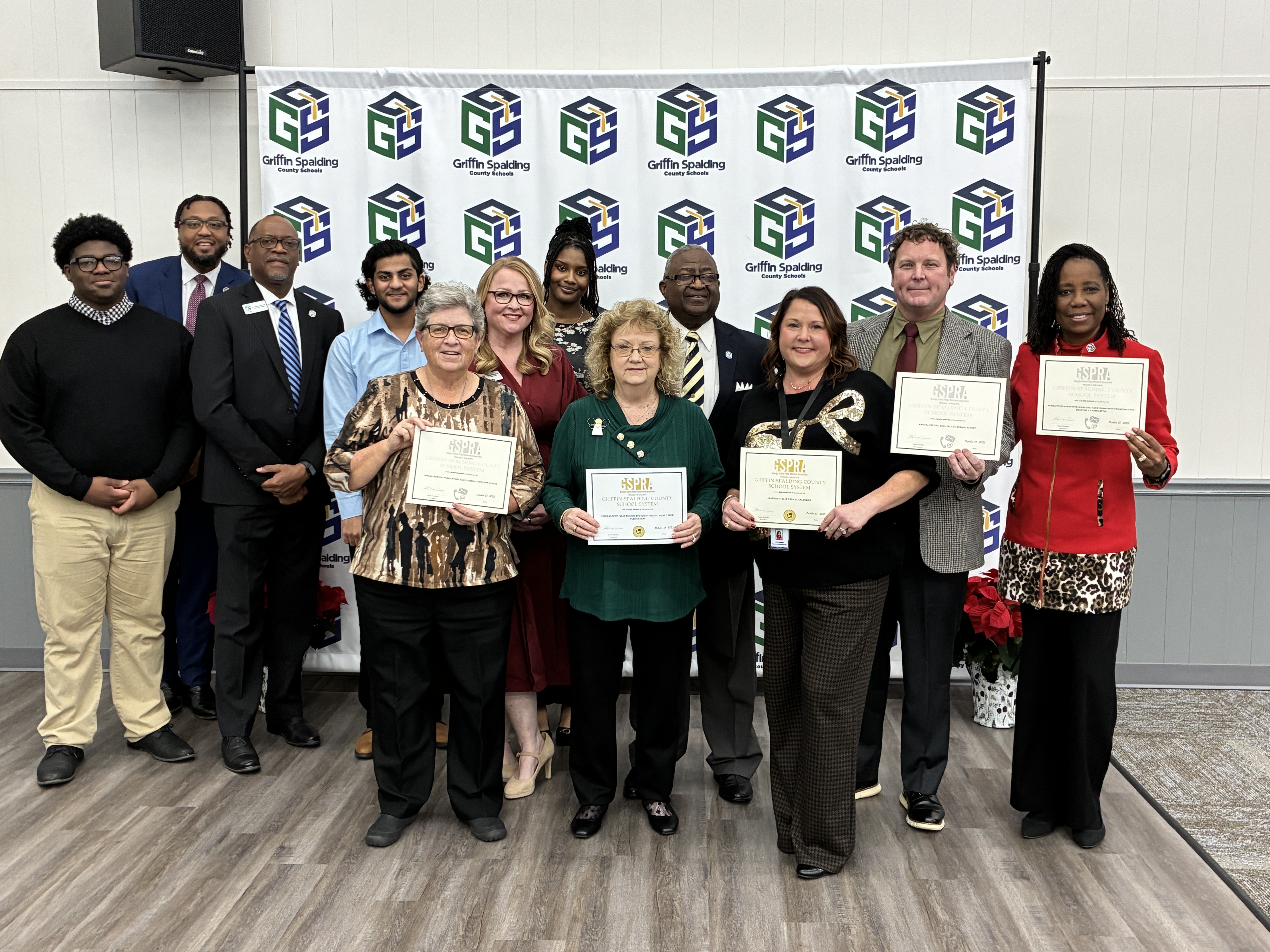 posing with certificates