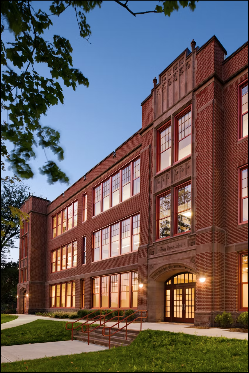 exterior of capital prep building at dusk