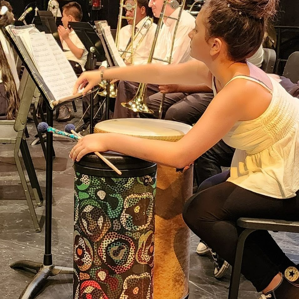 student playing the drums