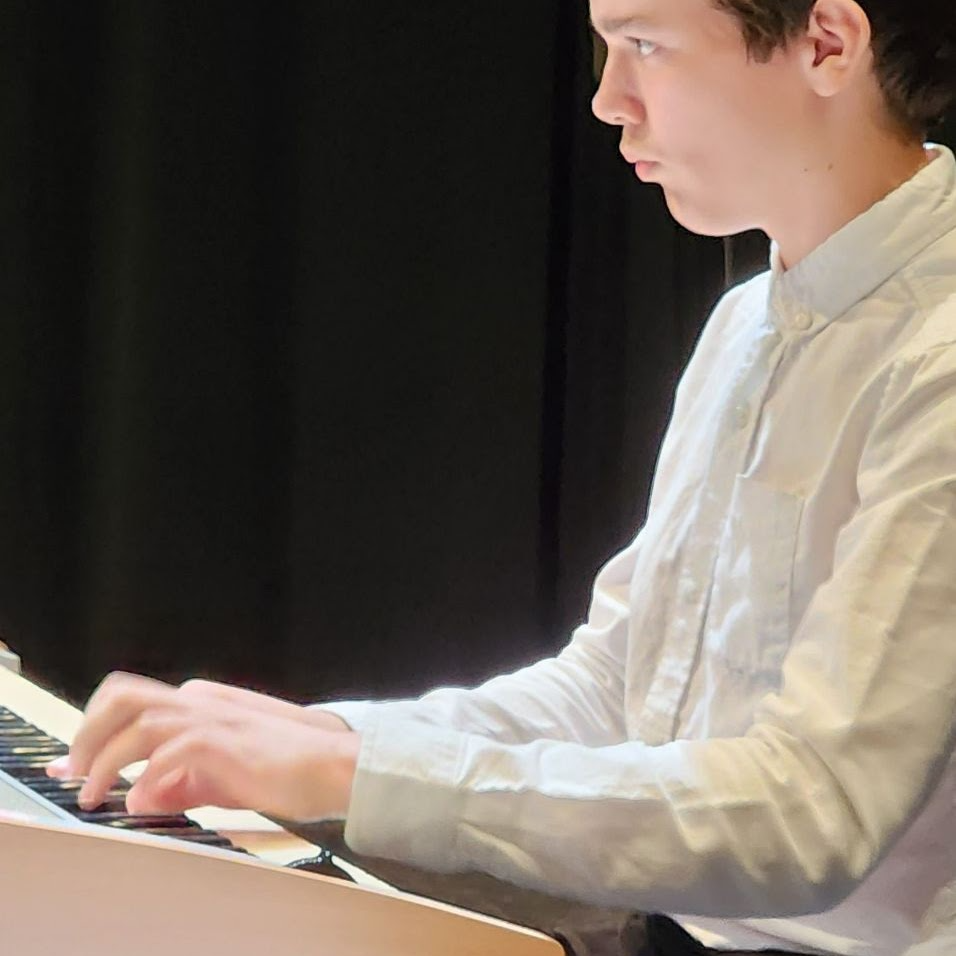 student playing the piano