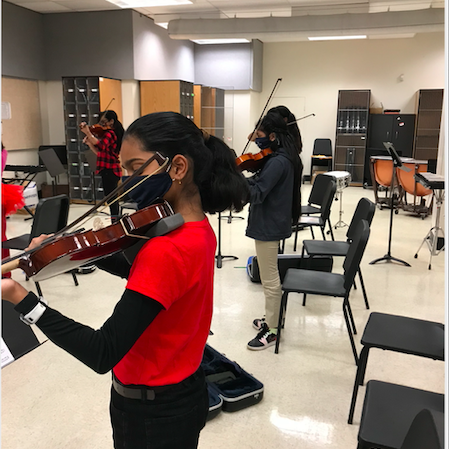 fifth grade violins playing violin