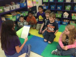 Fifth graders read to second graders