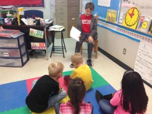 Fifth graders read to second graders