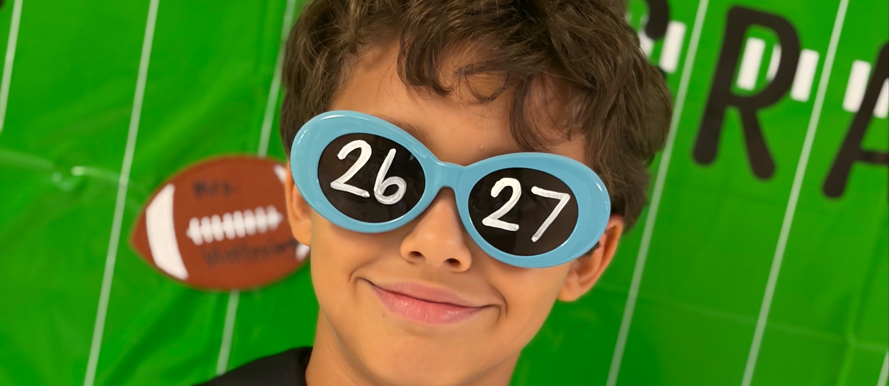 Male student in sunglasses on firstday of school.