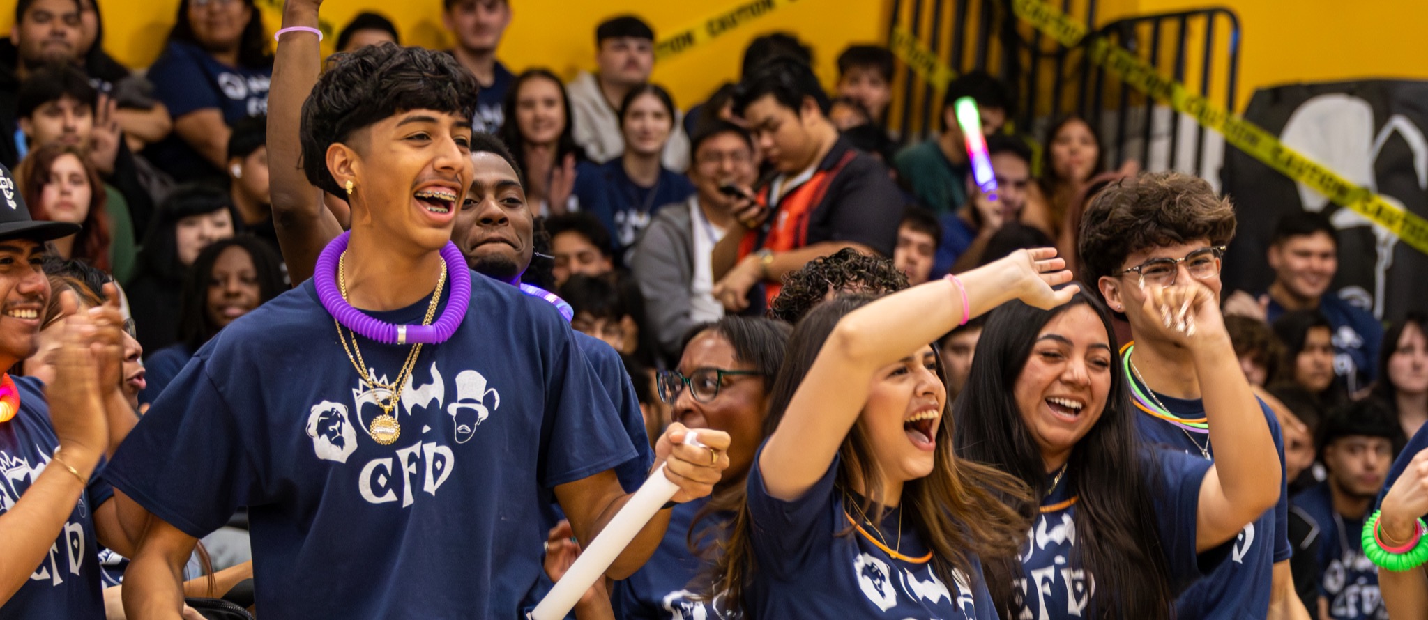 Students cheering at a fundraising assembly