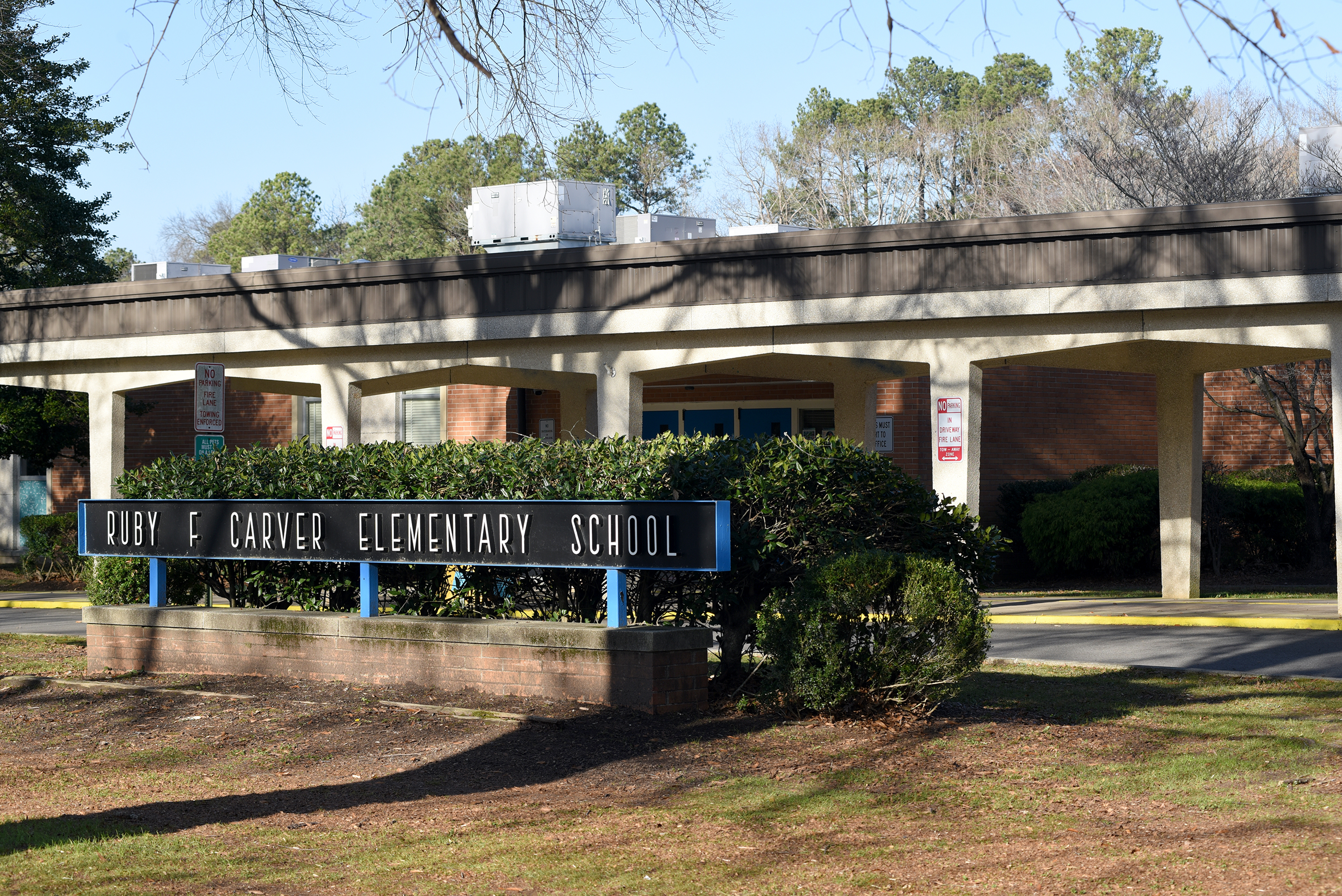 front of carver elementary building with school sign in front