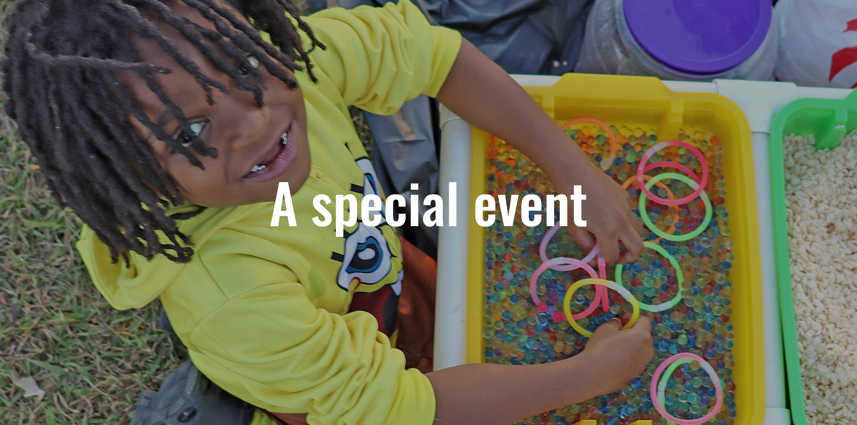 A boy with his hands in a sensory bucket and text on graphic that says "A special event"