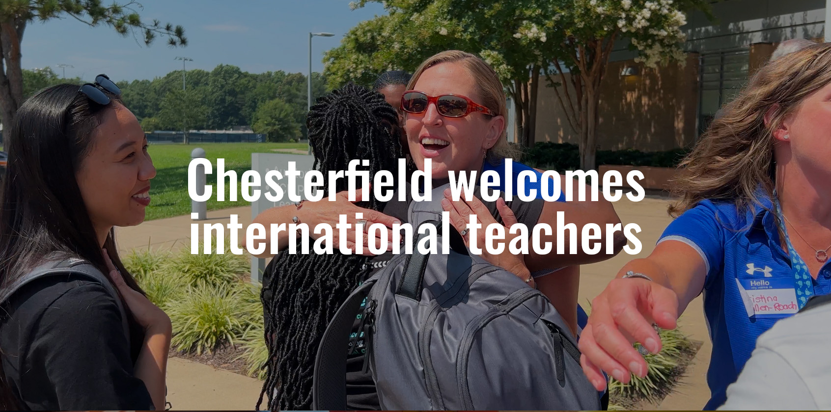 Staff member hugging a Participate Learning teacher outside