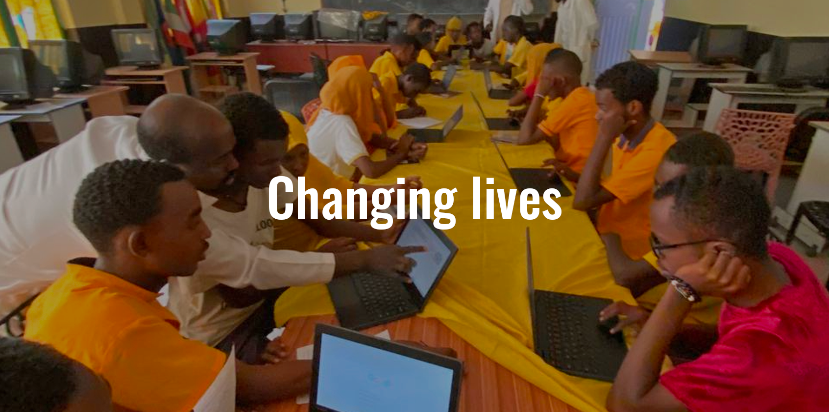 Students working on their laptops in class