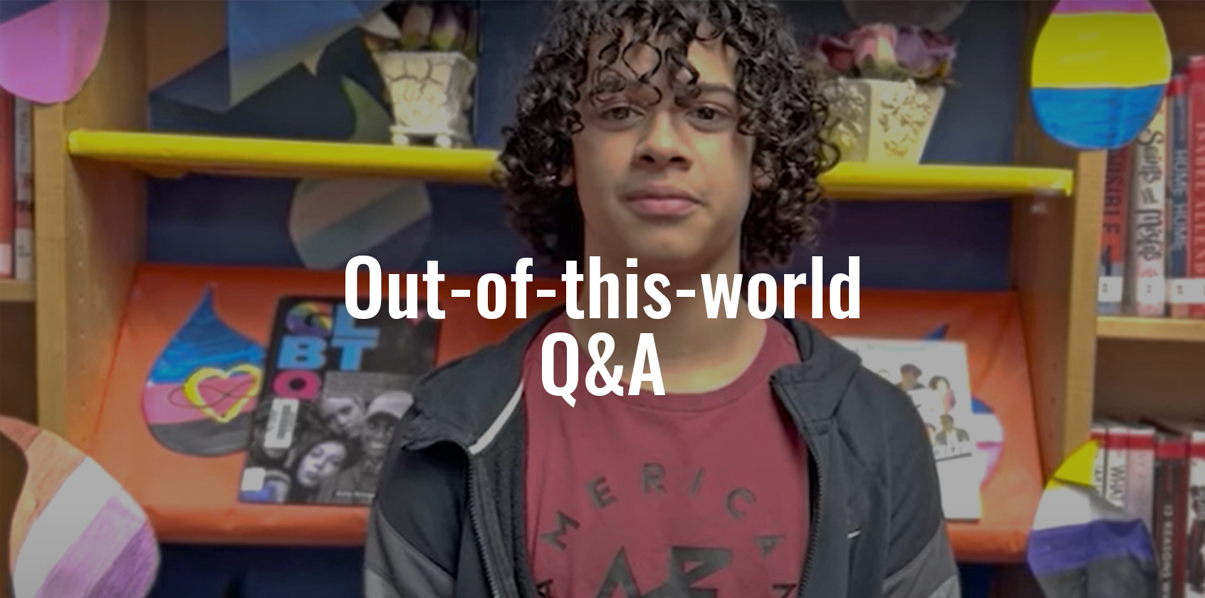 A student in the school library getting ready to answer a question for a video