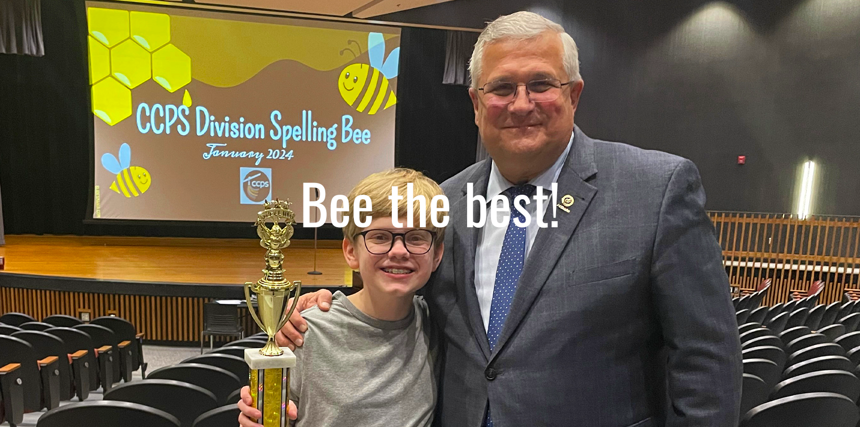 Superintendent poses with winner and his trophy 