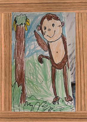 Artwork of a monkey and a banana tree