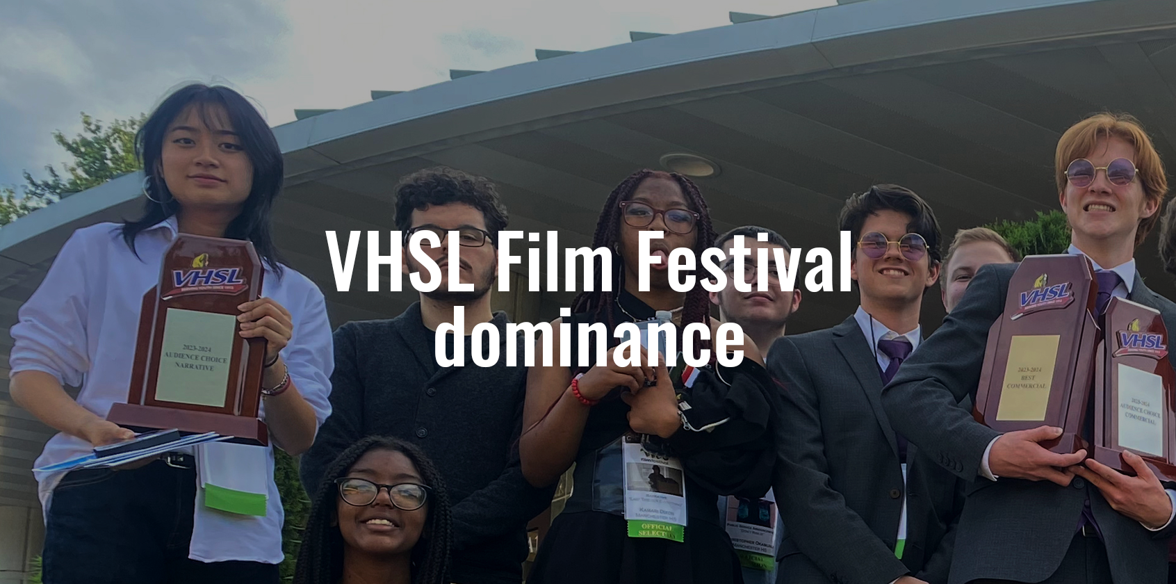 A group of students holding up awards and text that says "VHSL Film Festival dominance"