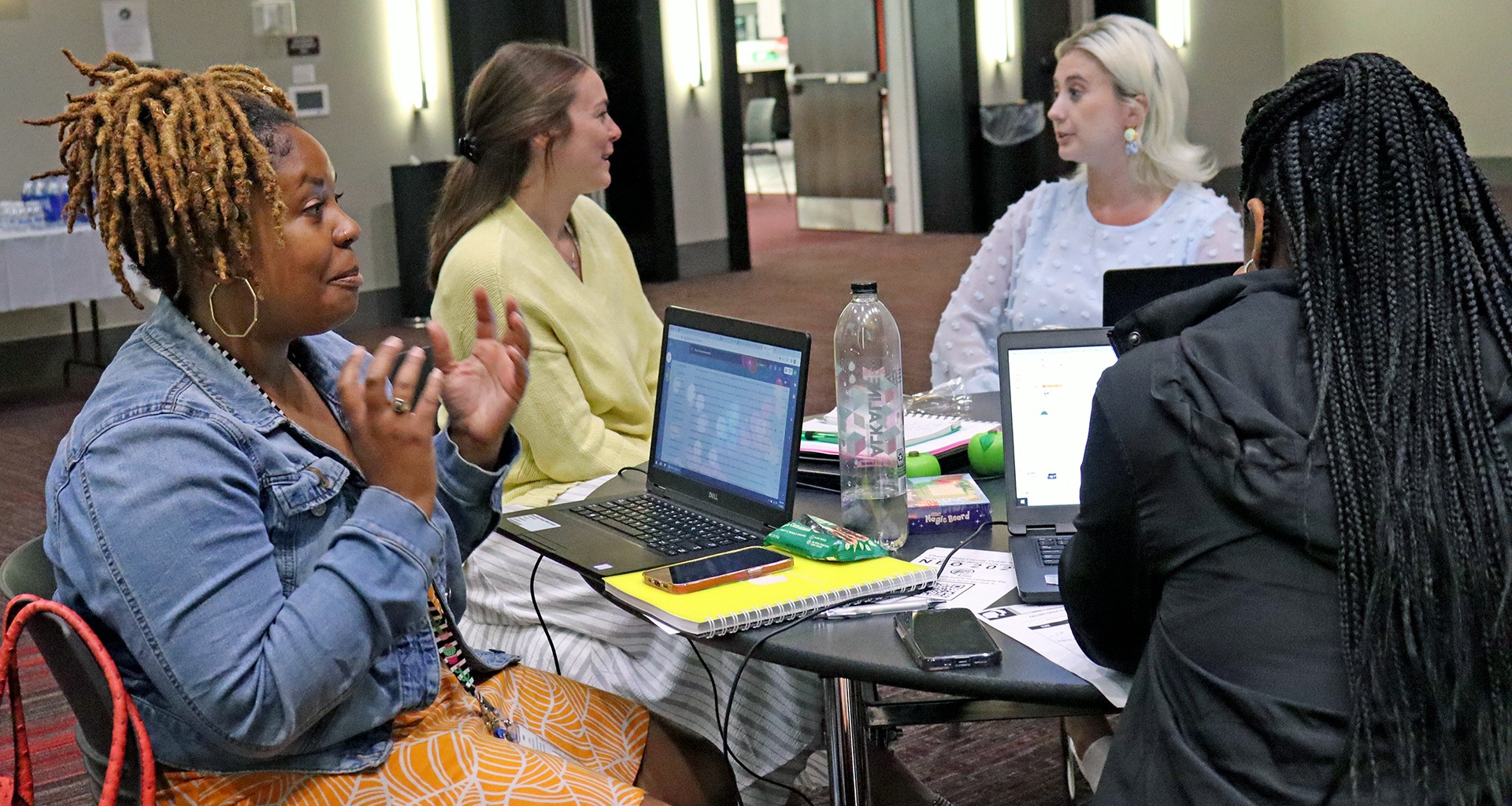 Group of women having conversations at a conference