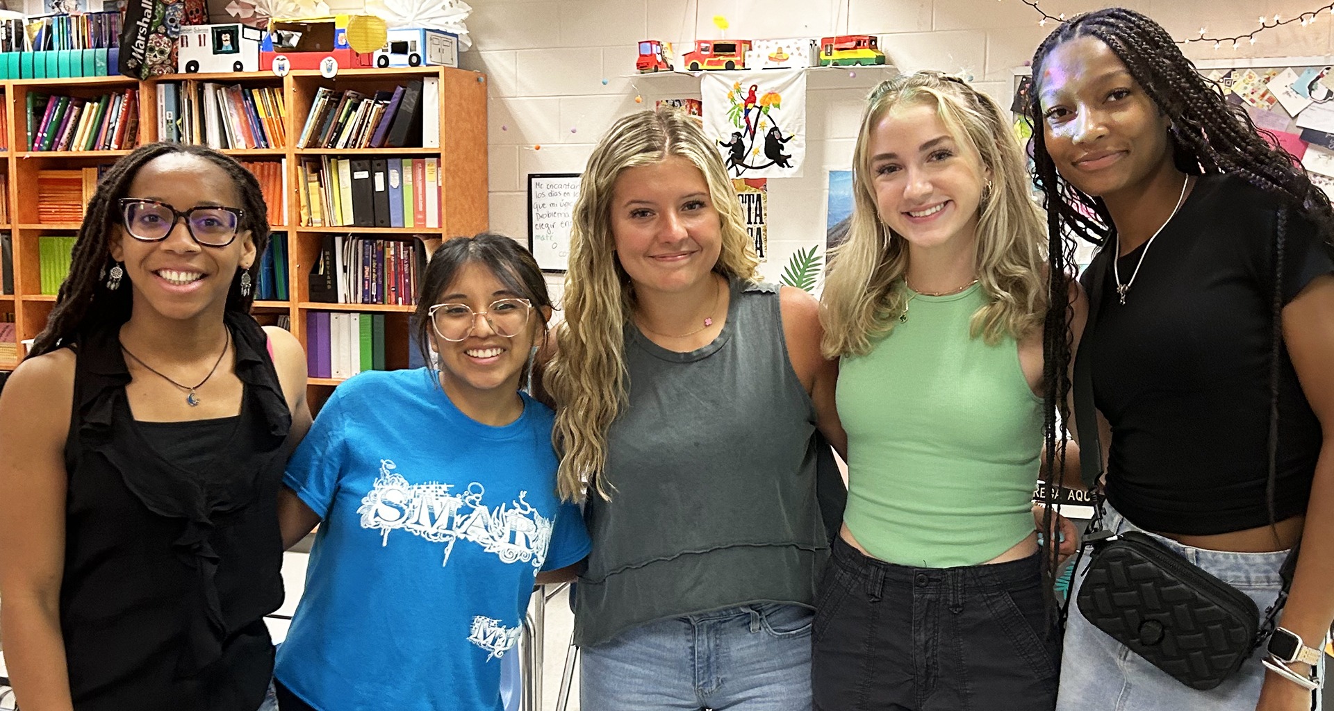 five students pose for a photo