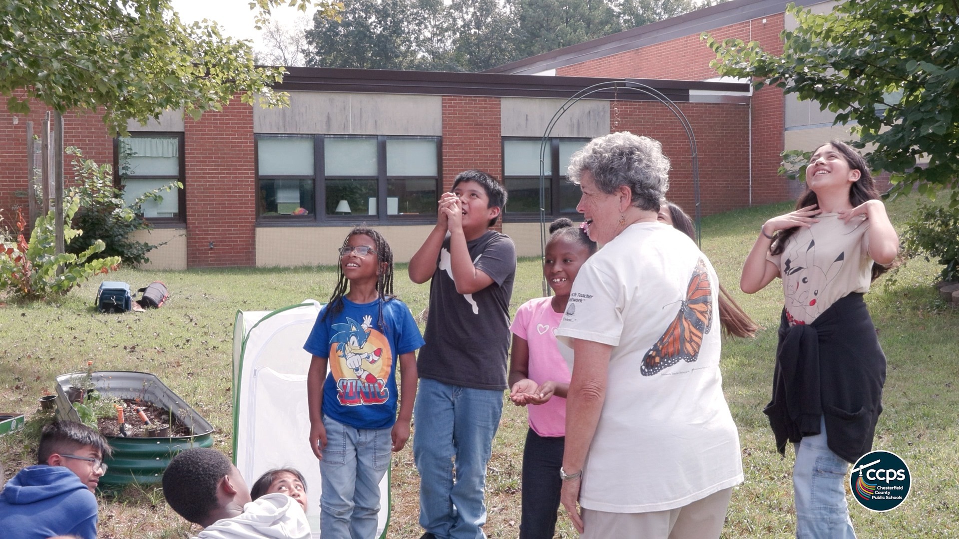 STudents watching butterflies