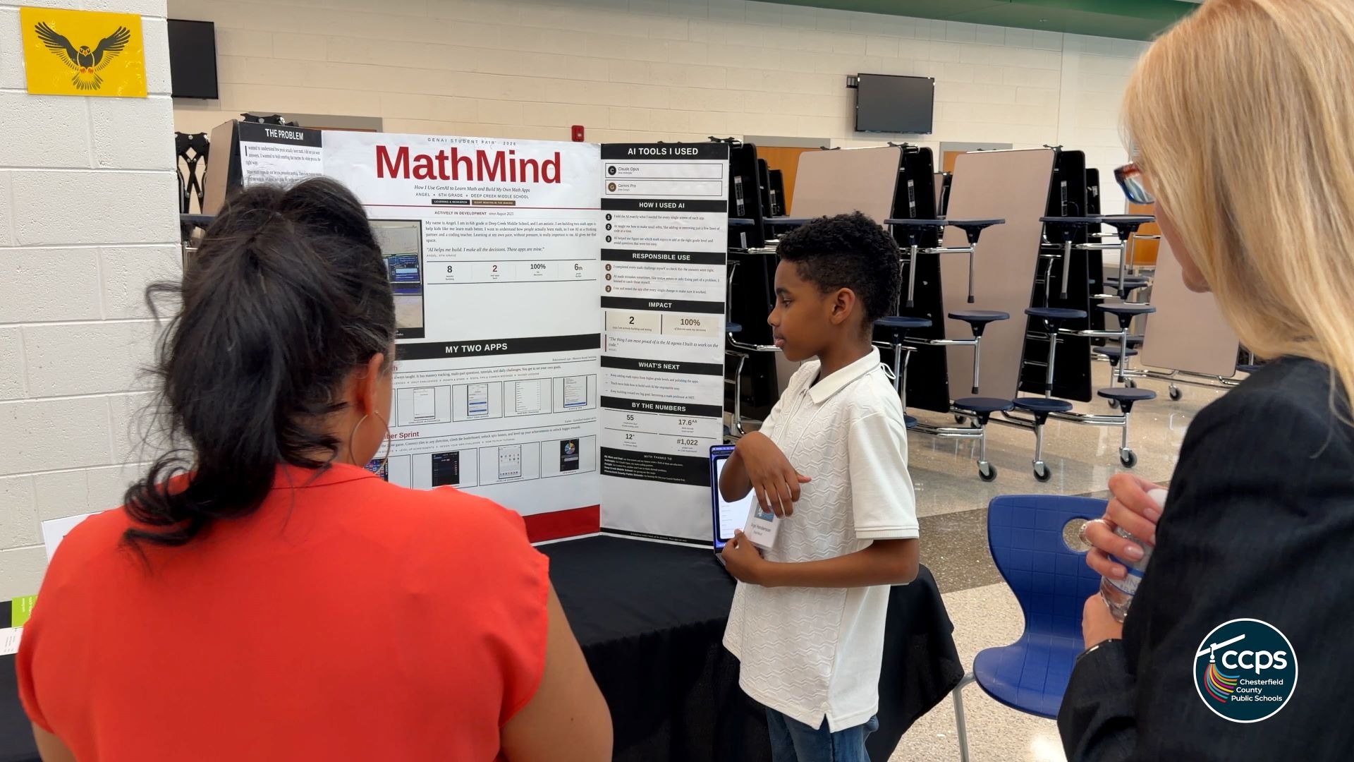 A student in front of a trifold board that reads "Math Mind"
