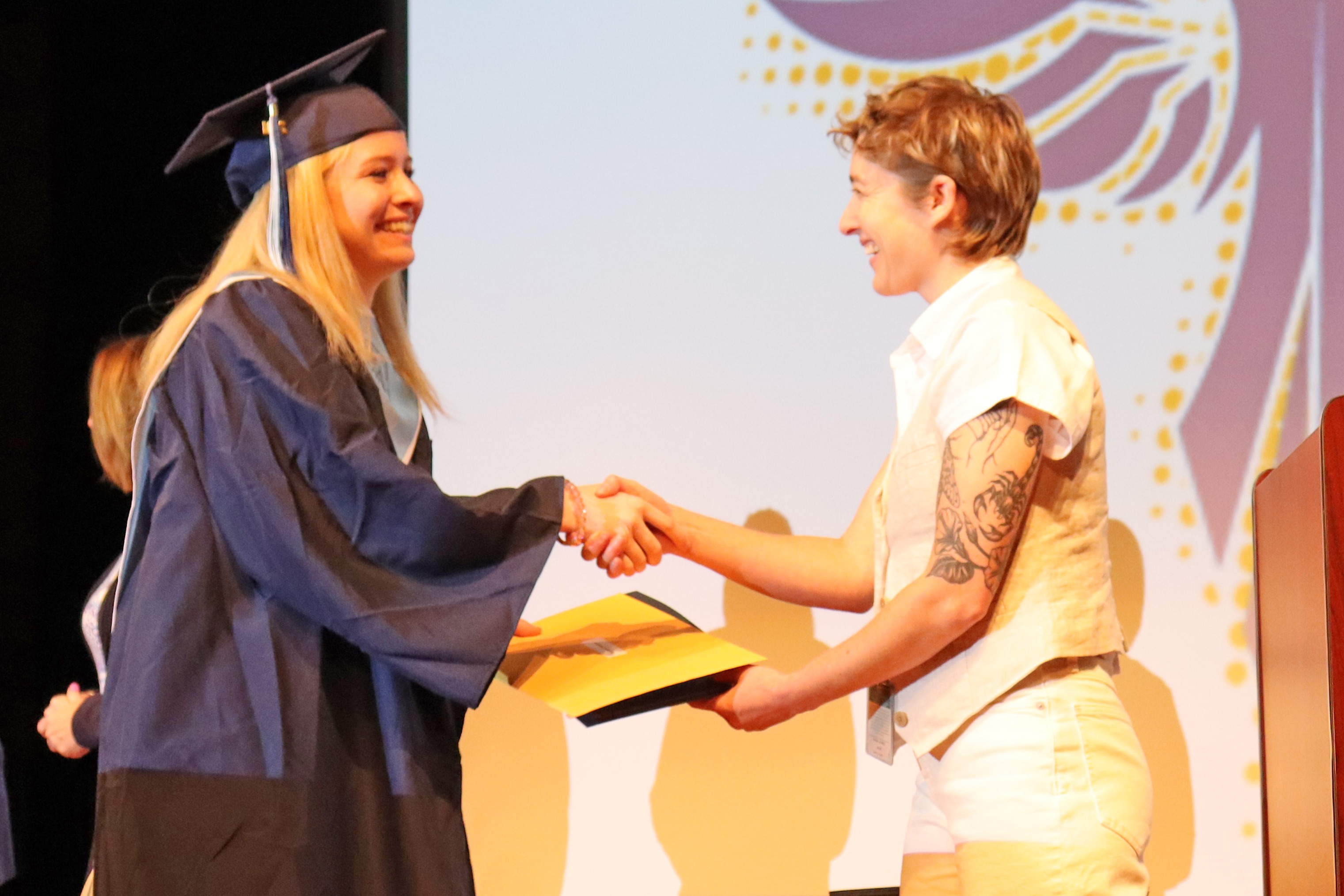student at completion ceremony