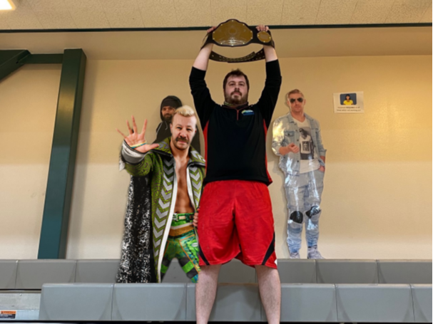 Chris DiGiro raising championship belt