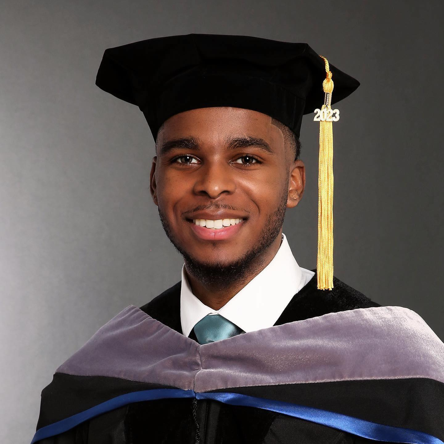 student in a cap and gown for doctorate degree