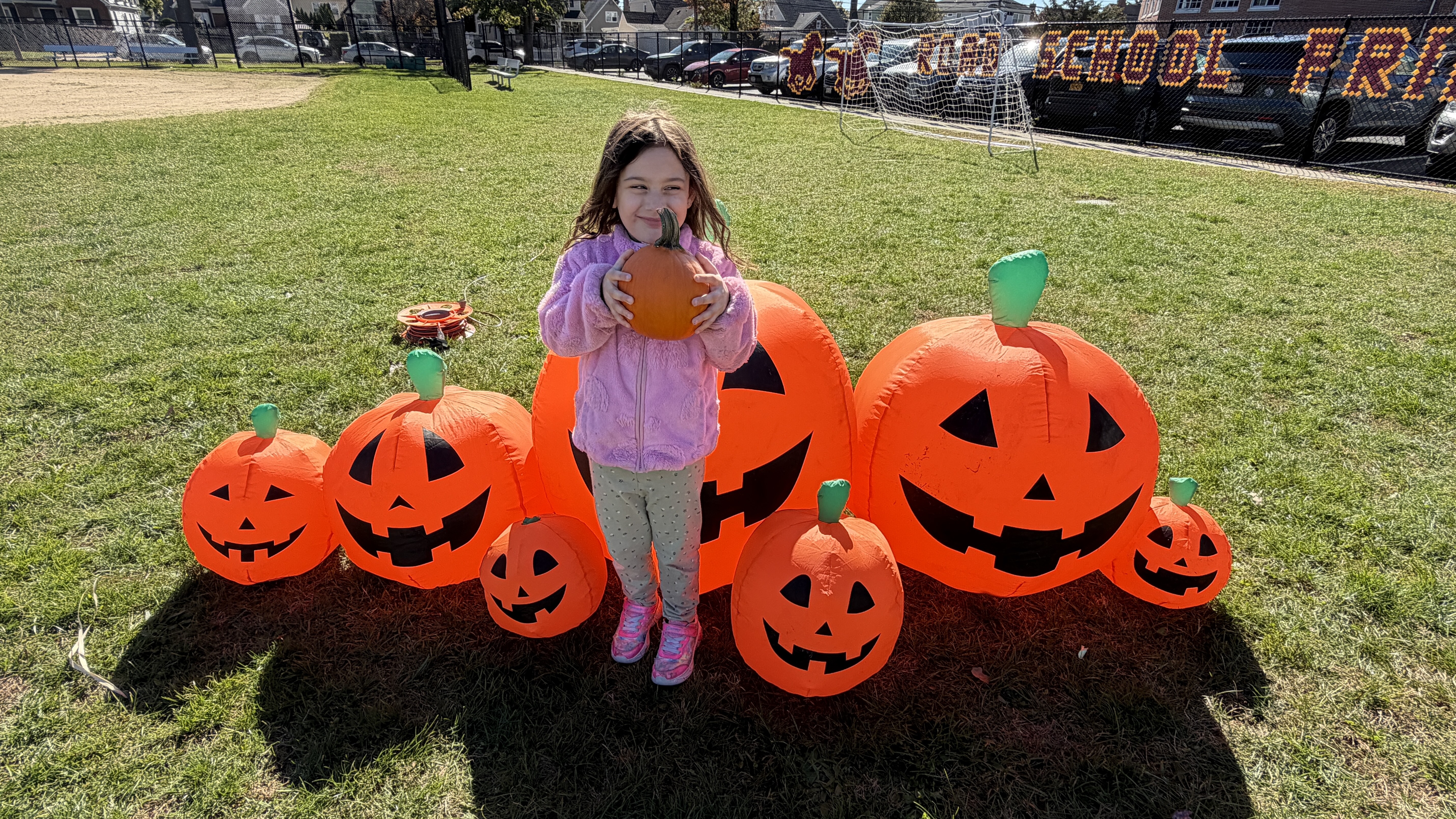child with a pumpkin