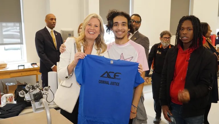grpahics students print t-shirts with superintendent
