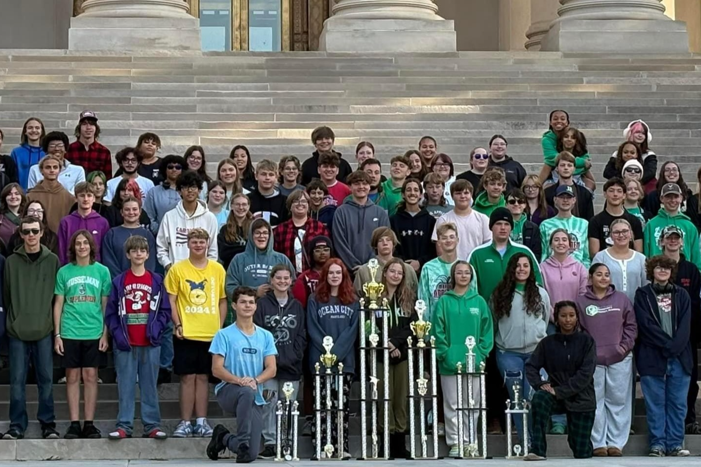 students with trophies