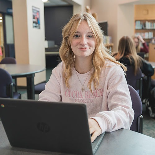 student using Chromebook