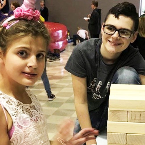 students playing Jenga game