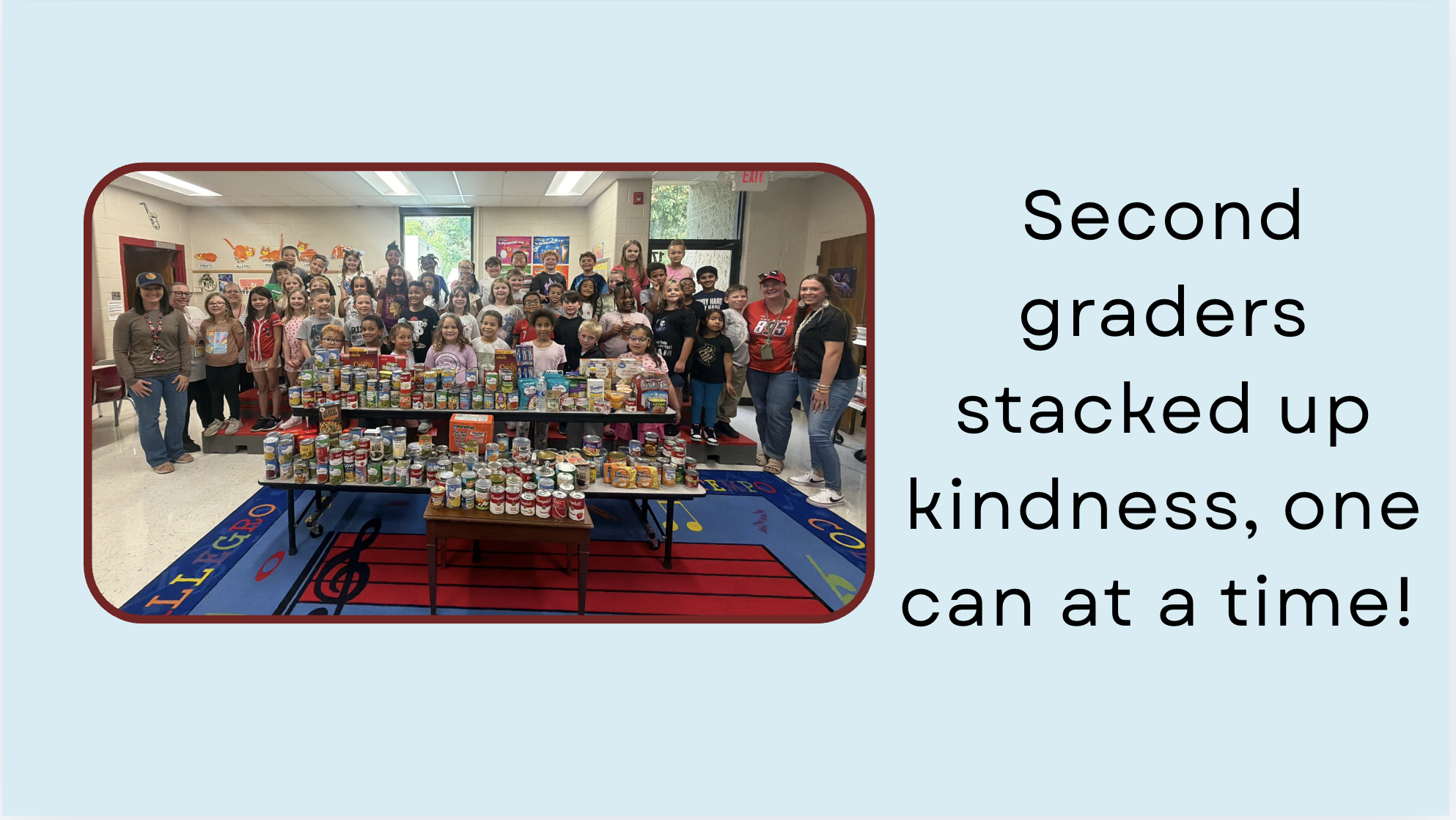 Second graders stacked up kindness, one can at a time. photo of second graders with donated cans