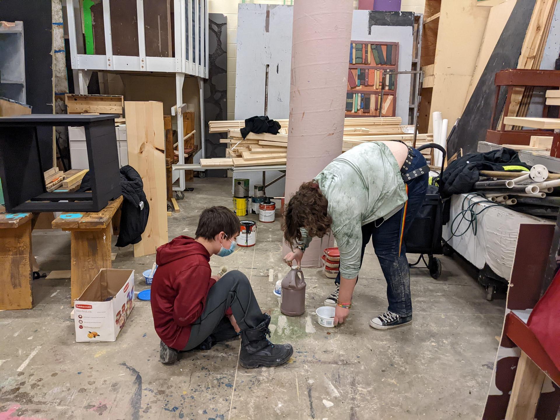 Students working on drama club props for the play 