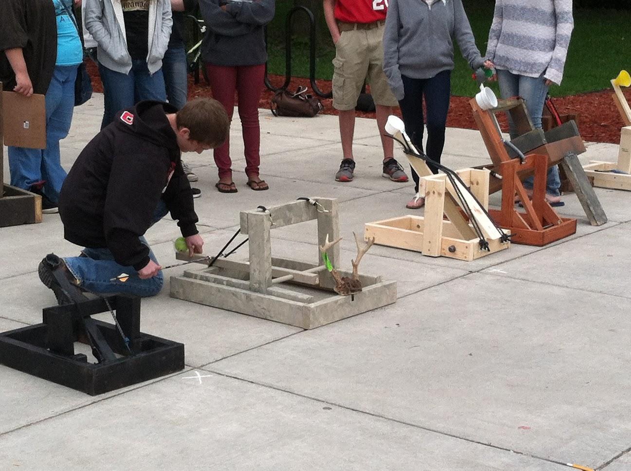 Students outside working on catapult protect 