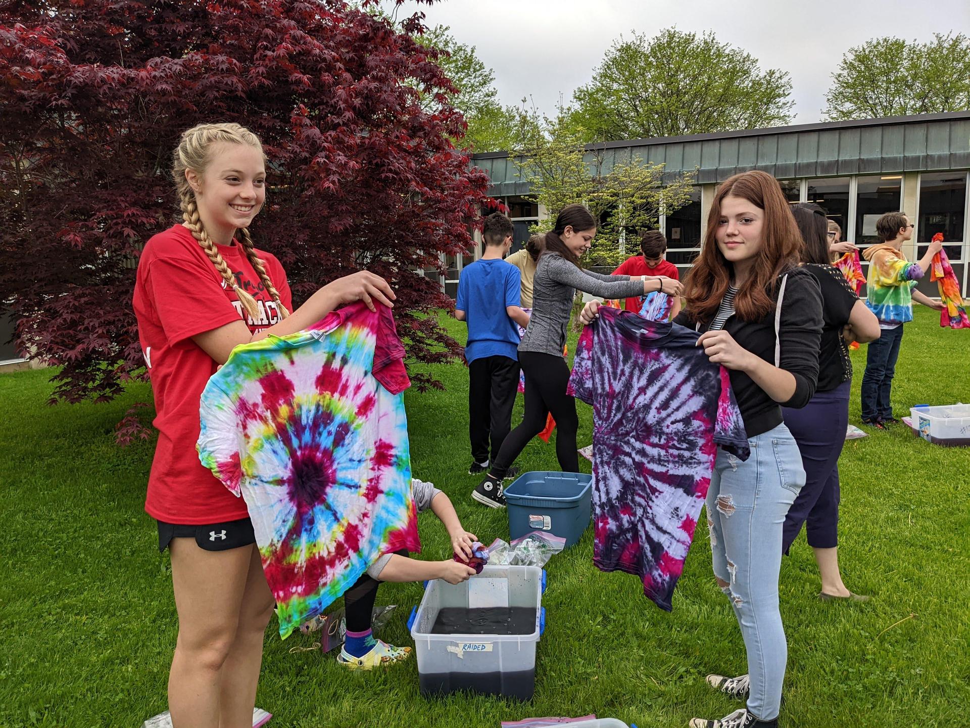 Students on the courtyard with their shirt 